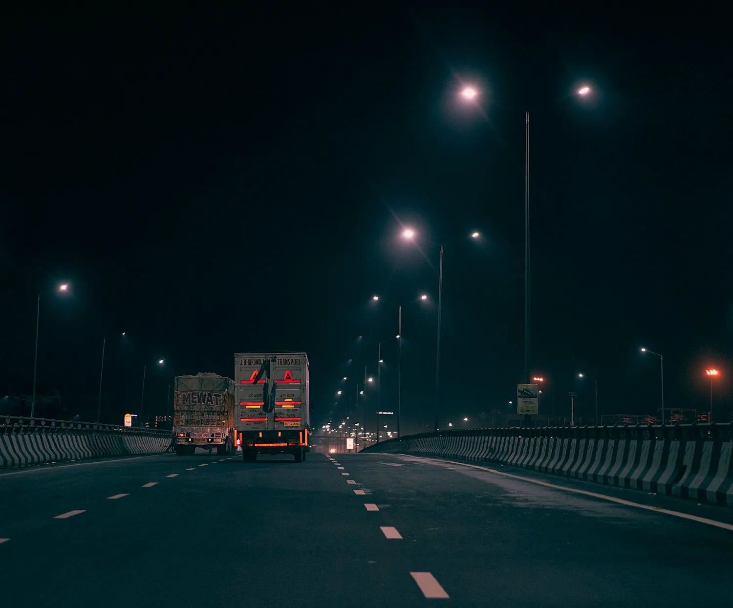 Truck traveling on a road at night