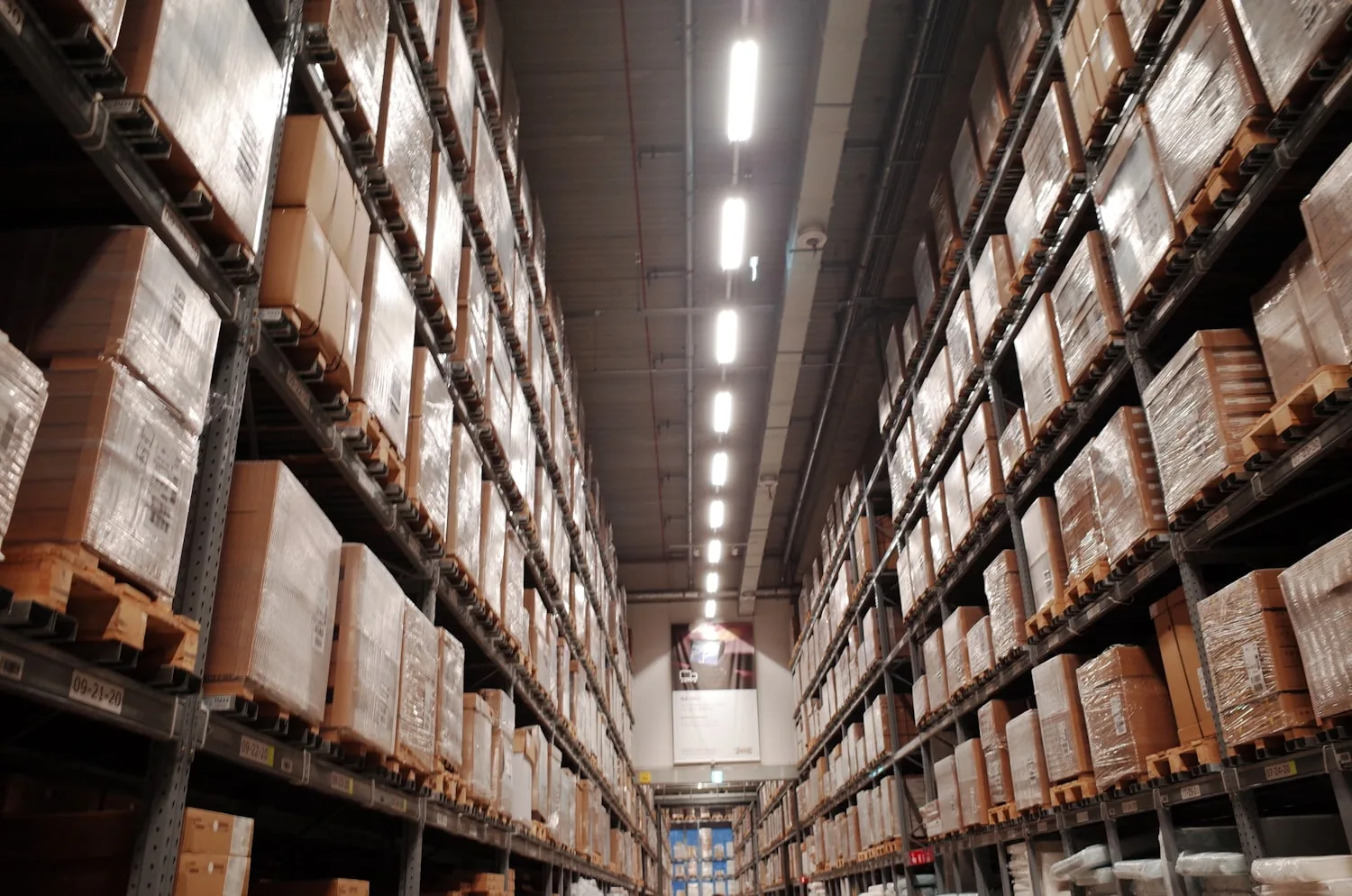 Warehouse aisle with boxed items on tall racks